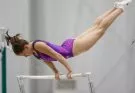 Girl on a gymnastics bar